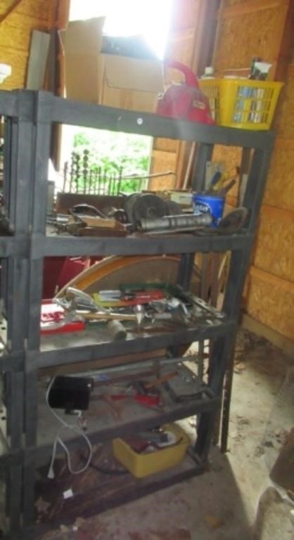 Garage shelf with contents includes wood drills,