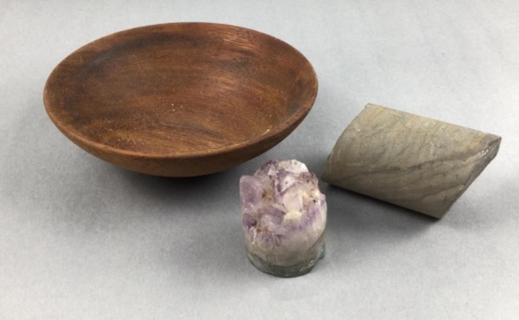 Stone core sample, amethyst cluster, and wooden