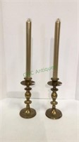 Pair of brass candlesticks with golden candles