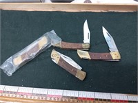 Four wooden handle knives