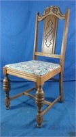 Wooden chair with floral pattern bottom
