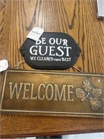 Signs “be our guest” and “welcome”