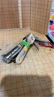 Caulking gun vice grips style pliers scraper