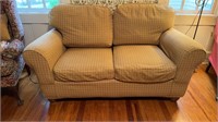 Overstuffed two person sofa love seat, with four