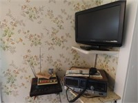 TV, CB radio, scanner, items on shelf.