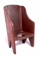 Potty chair, red paint over white pine,sloped back