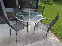 GLASS TOP PATIO TABLE WITH 4 METAL CHAIRS