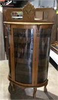 Delightful curved glass oak curio cabinet. All