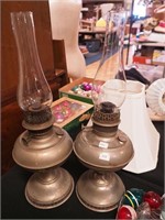 Two vintage metal kerosene lamps, both by