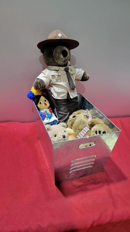 Metal bin full of stuffed animals