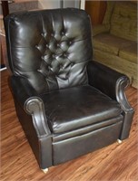 Vinyl upholstered reclining armchair; as is