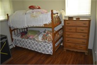 Maple chest of drawers and bunk beds with bedding;