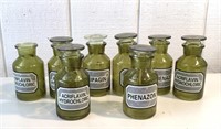 8 green apothecary jars