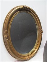 Mirror in oval frame