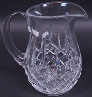 A cut crystal pitcher marked Waterford,