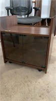 Rolling glass front cabinet, 22”x16”x24”