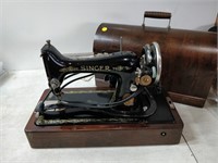 vintage singer sewing machine in curved case