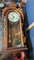 vintage clock with pendulum and key