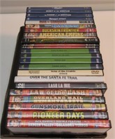 (24) DVDS IN CASES MOSTLY WESTERNS. NICE.