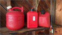 3 red gas cans