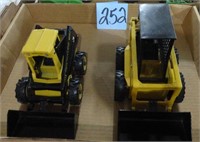 (2) Toy New Holland Skid Loaders