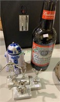 3 small sports trophies, one plastic R2-D2 toy,