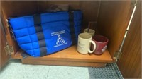 Contents of cabinet, insulated bag and mugs