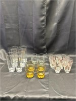 20 glasses, six tall, three with gold print too sm