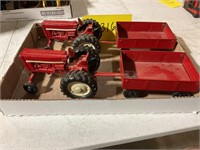 Lot of 2 diecast metal Farmall tractors and wagons