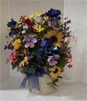 Floral arrangement in a metal half can replica -