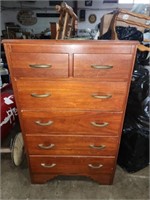 Six-drawer wood bedroom dresser.