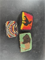 Three intricately beaded belt buckles in Native Am