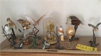 Birds of prey figurines, anniversary clock, and