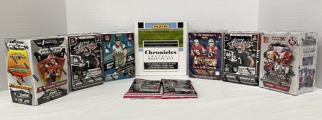 Nine Sealed Boxes or Packs of Football Cards