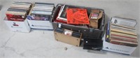Large assortment of records and cassettes that