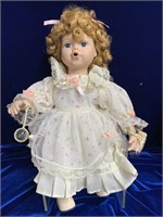 Porcelain doll blowing bubbles