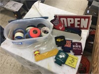 Tape, coozies, and signs,
