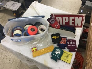Tape, coozies, and signs,