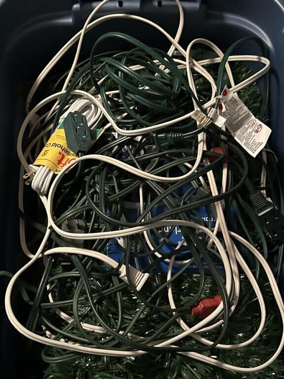 Tote of garland and extension cords