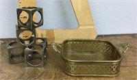 Decorative silver napkin rings and brass tray