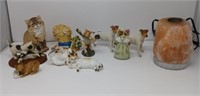 Decorative cats and dogs figurines and a Himalayan