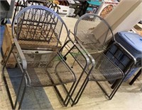 Outdoor metal round back arm chairs, lot of two.