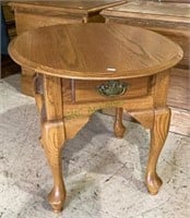 Queen Anne styled oval side table with one