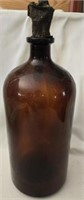 Large brown glass bottle