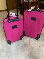 2 Pink Rolling Suit Cases