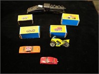 Three Matchbox cars by Lesney in boxes; one