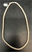 Ivory beaded necklace with threaded clasp 24"  No
