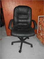One black swivel office chairs on rollers