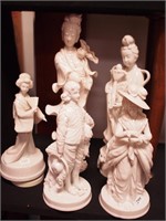 Five white china figurines of people: 7 1/2" high
