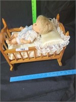 Small baby doll bed with baby